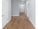 Hallway featuring consistent wood flooring throughout and bright paint at 1765 9Th Ave, Deland, FL 32724