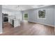 Modern open-concept kitchen with a center island, stainless appliances, and sliding glass doors at 1765 9Th Ave, Deland, FL 32724