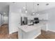 This kitchen features a quartz island and countertops, stainless steel appliances, and decorative pendant lighting at 1765 9Th Ave, Deland, FL 32724