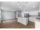 Spacious open-concept kitchen with a center island, stainless steel appliances, and a dining area at 1765 9Th Ave, Deland, FL 32724