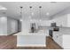 Modern kitchen featuring stainless steel appliances, white cabinets, and a center island at 1765 9Th Ave, Deland, FL 32724