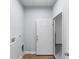 Laundry room featuring hardwood floors and a door to the laundry machine at 1765 9Th Ave, Deland, FL 32724