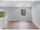 Open living room area with back yard view, tray ceilings, and modern design at 1765 9Th Ave, Deland, FL 32724