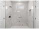 Modern bathroom featuring a marble walk-in shower with tiled floors and glass door at 1765 9Th Ave, Deland, FL 32724