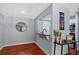 A dining area with hardwood floors, a decorative mirror, and a kitchen pass-through at 2035 Dixie Belle Dr # 2035C, Orlando, FL 32812