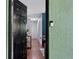 The front door opens to reveal a hallway with hardwood floors and a closet at 2035 Dixie Belle Dr # 2035C, Orlando, FL 32812