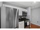 Kitchen featuring stainless steel appliances and white cabinetry at 2035 Dixie Belle Dr # 2035C, Orlando, FL 32812
