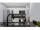 Kitchen with stainless steel appliances, granite countertops and hardwood floors at 2035 Dixie Belle Dr # 2035C, Orlando, FL 32812