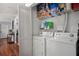 Convenient laundry room with washer, dryer, and storage space for supplies at 2035 Dixie Belle Dr # 2035C, Orlando, FL 32812