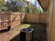 Private backyard area with a wooden fence and an AC unit at 220 Cherokee Ct # 116, Altamonte Springs, FL 32701