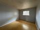 Simple bedroom featuring wood floors, neutral walls, and natural light at 220 Cherokee Ct # 116, Altamonte Springs, FL 32701