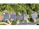 Aerial view of backyard pools surrounded by tropical trees and landscaping in a residential area at 2342 Northumbria Dr, Sanford, FL 32771
