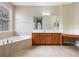 Bathroom with a soaking tub and separate vanity area offers a spa-like experience at 2342 Northumbria Dr, Sanford, FL 32771