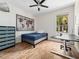 Comfortable bedroom with wood flooring and a large window at 2342 Northumbria Dr, Sanford, FL 32771