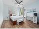 Inviting bedroom with a modern design and wood laminate flooring at 2342 Northumbria Dr, Sanford, FL 32771