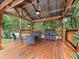 Well-appointed cabana featuring a ceiling fan and comfortable seating, perfect for outdoor relaxation at 2342 Northumbria Dr, Sanford, FL 32771