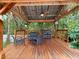 Inviting cabana featuring a ceiling fan and comfortable seating perfect for outdoor relaxation at 2342 Northumbria Dr, Sanford, FL 32771