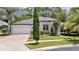 Charming single-story home with a two-car garage and well-maintained lawn at 2342 Northumbria Dr, Sanford, FL 32771