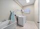 Functional laundry room with a sink and washer/dryer at 2342 Northumbria Dr, Sanford, FL 32771