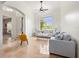 Bright living room with large window, neutral furniture, and elegant tile flooring at 2342 Northumbria Dr, Sanford, FL 32771