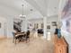 Open-concept living space with travertine floors, ample natural light, and modern décor at 2342 Northumbria Dr, Sanford, FL 32771