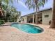 Inviting pool with covered patio area and brick deck, perfect for outdoor enjoyment at 2342 Northumbria Dr, Sanford, FL 32771