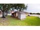 Spacious backyard featuring a shed, green lawn, and partial fence at 3552 Macauley Ct, Ocoee, FL 34761