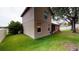 Exterior of home features green lawn and patio in the backyard at 3552 Macauley Ct, Ocoee, FL 34761