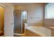 Bright bathroom with a large tub and a separate shower at 3552 Macauley Ct, Ocoee, FL 34761
