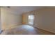 Neutral bedroom with a vaulted ceiling and a window overlooking the green outdoors at 3552 Macauley Ct, Ocoee, FL 34761