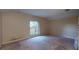 Spacious bedroom with natural light, neutral walls, and carpet flooring, providing a relaxing retreat at 3552 Macauley Ct, Ocoee, FL 34761
