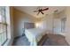 Bedroom with neutral carpet, ceiling fan, and large window at 3552 Macauley Ct, Ocoee, FL 34761