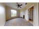 Neutral toned carpeted bedroom featuring a window and natural light at 3552 Macauley Ct, Ocoee, FL 34761