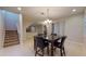 Spacious dining area with tile flooring, chandelier, and staircase to the second level at 3552 Macauley Ct, Ocoee, FL 34761
