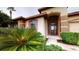 Charming front entrance with a glass front door and lush landscaping at 3552 Macauley Ct, Ocoee, FL 34761