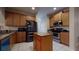 Well-equipped kitchen with stainless steel appliances, granite countertops, and an island for meal preparation at 3552 Macauley Ct, Ocoee, FL 34761