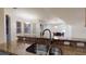 Kitchen sink with stainless steel faucet and granite counter top overlooking dining area at 3552 Macauley Ct, Ocoee, FL 34761