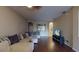 Spacious living room featuring hardwood floors and a large sectional sofa at 3552 Macauley Ct, Ocoee, FL 34761