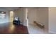 Open living area with dark wood flooring, decorative columns, and neutral wall colors at 3552 Macauley Ct, Ocoee, FL 34761