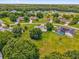 Property featuring a pool and verdant surroundings, perfect for a serene living environment at 3750 Oak Pointe Blvd, Kissimmee, FL 34746