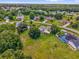 Sprawling property with mature trees, pool, and manicured lawn, offering privacy and curb appeal at 3750 Oak Pointe Blvd, Kissimmee, FL 34746