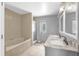 Bright bathroom with a double sink vanity and a combined tub and shower at 3750 Oak Pointe Blvd, Kissimmee, FL 34746