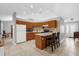 Functional kitchen offers wood cabinets, a breakfast bar, and views into the adjoining living area at 3750 Oak Pointe Blvd, Kissimmee, FL 34746