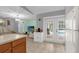 Open-concept space with kitchen, living, and outdoor access creating a seamless flow for modern living at 3750 Oak Pointe Blvd, Kissimmee, FL 34746