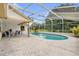 Backyard pool area with a screened enclosure and a nice view of surrounding trees at 3750 Oak Pointe Blvd, Kissimmee, FL 34746