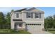 Charming two-story home featuring a gray exterior, attached two-car garage, and well-maintained front yard at 3856 Corsican Pl, Lake Alfred, FL 33850