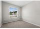 Neutral bedroom with carpet and a window to let in natural light at 4028 Southern Vista Loop, St Cloud, FL 34772