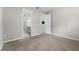 Carpeted bedroom with entry to bathroom and hallway at 4028 Southern Vista Loop, St Cloud, FL 34772
