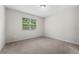Carpeted bedroom with a window providing natural light at 4028 Southern Vista Loop, St Cloud, FL 34772