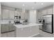 Modern kitchen featuring stainless steel appliances, a center island, and pendant lighting at 4028 Southern Vista Loop, St Cloud, FL 34772